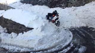 KTM 990 Adventure  plowing through deep snow on Passo dello Stelvio -  Stilfser Joch, 2757 m n.p.m.