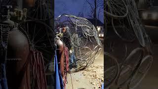 Welding Huge Bicycle Wheel Icosahedron Sculpture