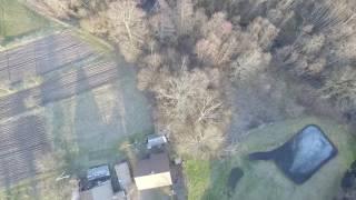 Vertical Flight Over Buildings In Country - cutestockfootage.com