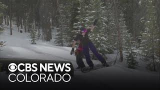 Women soar at terrain park at Copper Mountain while supporting each other