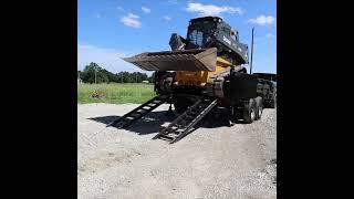 How to Safely Load and Haul a Skid Steer in a Dump Trailer