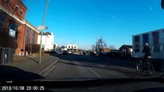 Bad cyclist drifts across lanes without warning.