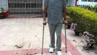 Walking again after 3yrs of spinal cord injury.wmv