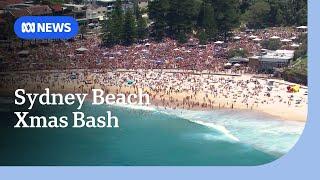 Thousands pack Sydney beach for 'Orphan's Christmas' | ABC NEWS