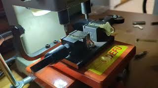 Cutting Schlage common home key with automotive key cutting machine