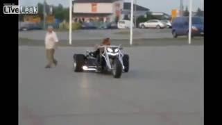 kaszpir V8 trike doing wheelies and donuts in a carpark.