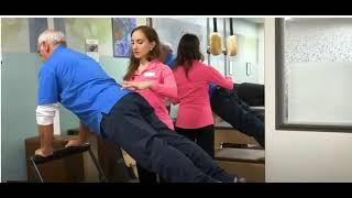 Dr  Carminati providing Pilates Rehabilitation