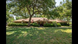 Secluded charming Texas home on 2 acres surrounded by a majestic 12,000 acre ranch. A rare find.