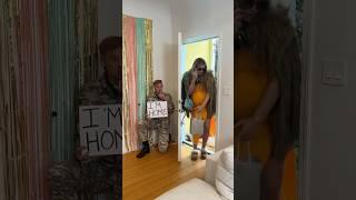 Soldier hides behind door to surprise wife 