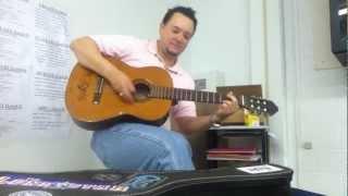 math teacher singing and playing guitar