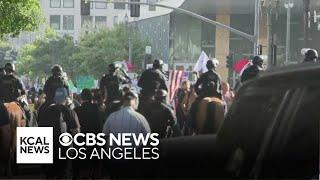 LAPD uses horses to disperse protesters from downtown Los Angeles