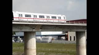 Ground Level View of River Crossing and MRT Trains