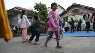 Indonesian kids play as other practice a martial art called Baringin Sakti in a Jakarta kampung