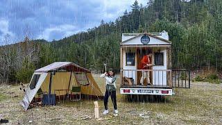 CARAVAN CAMP BY THE RIVER IN THE RAIN