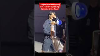 Donghae was seen holding back tears after greeting a fan using a wheelchair