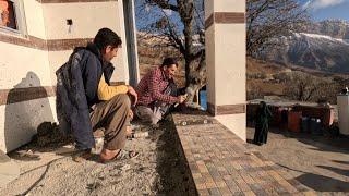 Nomadic Construction: Cementing the Floor and Roofing the Wooden Hut