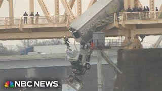 Louisville firefighters rescue driver from truck dangling off bridge