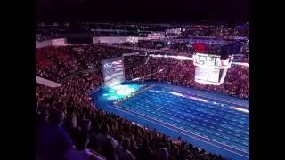 U.S. Swimming fans instantly unite to sing the National Anthem when the singer's microphone fails