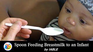 Spoon Feeding Breastmilk to a Newborn