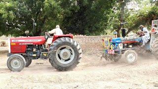 Mf 385 pulling stuck ford 3610 with loaded trolley 