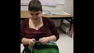 Blind student knits during class to help charity