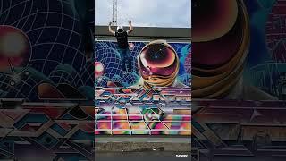 An ai generated video of a man jumping into graffiti