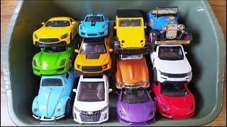 Box Full of model cars : Porsche, Tesla, Peugeot, Volvo, Close-up toy car review Tomica L108