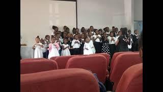 FAITH IS A FLAG FLOWN HIGH BY THE CHILDREN'S CHOIR, LMMU CAMPUS MINISTRIES.