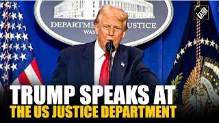 US President Donald Trump delivers remarks at the Department of Justice