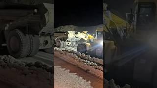 Heavy Machines in Action Komatsu Loader Pushes Belaz Dump Truck