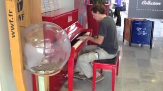 Larry McDonough plays in the Charles de Gaulle airport in Paris