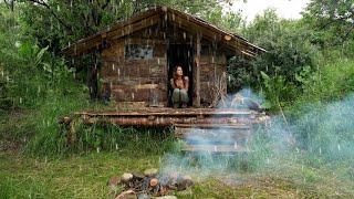 Rain and thunderstorm caught the girl in the forest. Solo overnight in log cabins