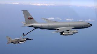 KC-135 Tanker refueling a Jet Fighter