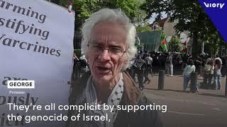 Pro-Palestinian protesters gather outside the US Consulate in Amsterdam to condemn Israel's attack.