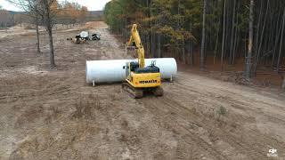 Komatsu pc170-11 moving 10000lb water tank