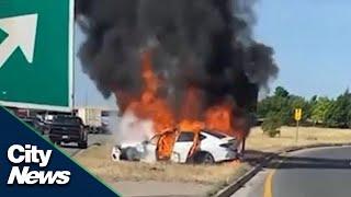 CAUGHT ON CAMERA: Men save driver from burning vehicle