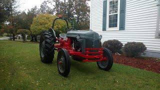 Installing the new front bumper on a 1952 Ford 8N farm tractor