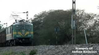 INDIAN RAILWAYS: GREEN MONSTER LALLAGUDA WAG-9 LOCOMOTIVE WITH A FREIGHT SEEMS TO BE IN A HURRY