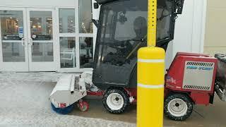 Ventrac Clearing Snow with Broom and Salting