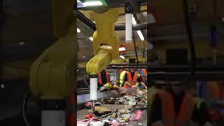 What is the FANUC robot doing? It's recycling would you believe!!