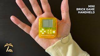 This cheap handheld is nearly the size of a palm  | Mini “Brick Game” Handheld Keychain