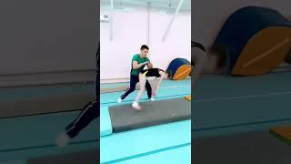 Beautiful Gymnastics Coach helping