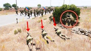 Ukrainian troops crawl along the grass to ambush a Russian counterattack