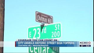 City unveils street sign toppers for Chatman Hill neighborhood