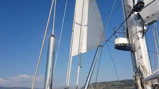 Unfurling the head sail onboard Parsifal 3 while shooting below deck sailing yacht