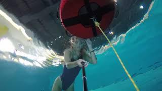 girl underwater try to sitting in cave in 7m deep pool with contractions