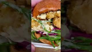 Trying a shrimp burger from Spitalfields Market