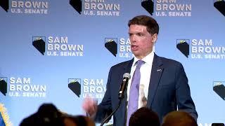 Sam Brown speaks at watch party