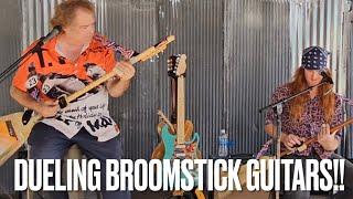 8 Ball Aitken & Steve Arvey Record The First Video Of Dueling 3 String Guitars Made From Broomsticks