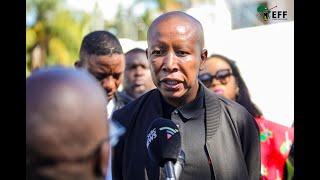 President  Julius Malema addressing members of the media outside the Modise home.